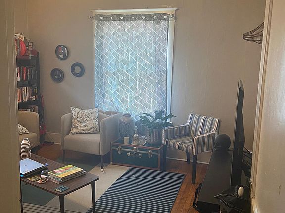 Living room with closet on the right