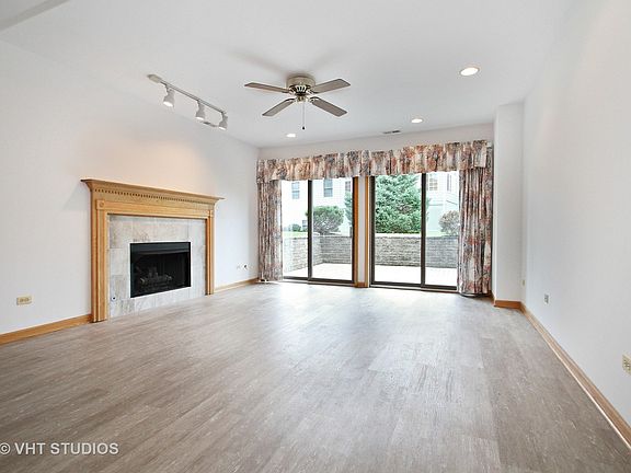 Large Family Room in the Basement with fire place. Walk out to patio.