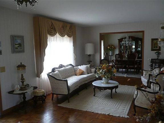 Enter into cozy warm home with hardwood floors in the entry, living and dining