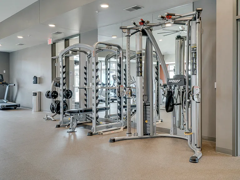 Our massive fitness center features a variety of weightlifting machines.