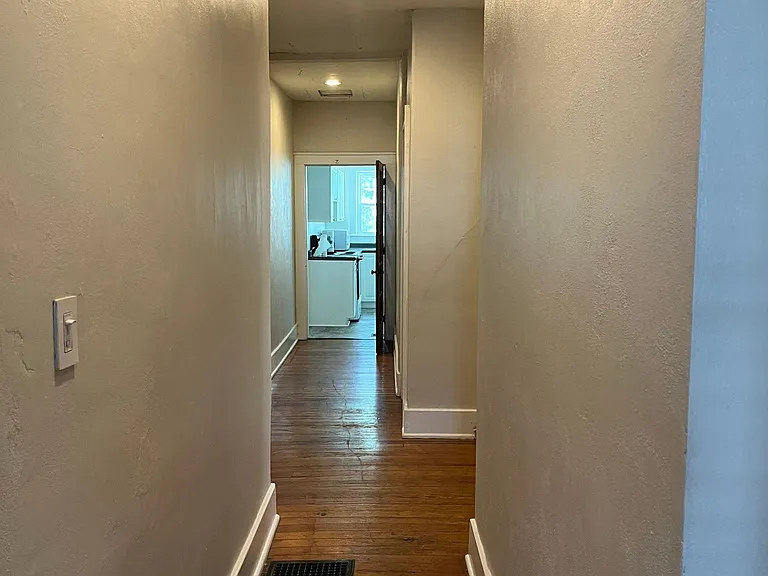 Bowling ball hallway from front door to kitchen!