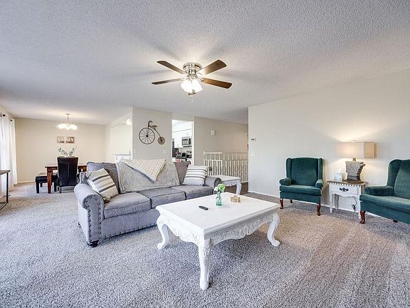 Spacious and airy living room. It opens up to the dining area and updated kitchen.