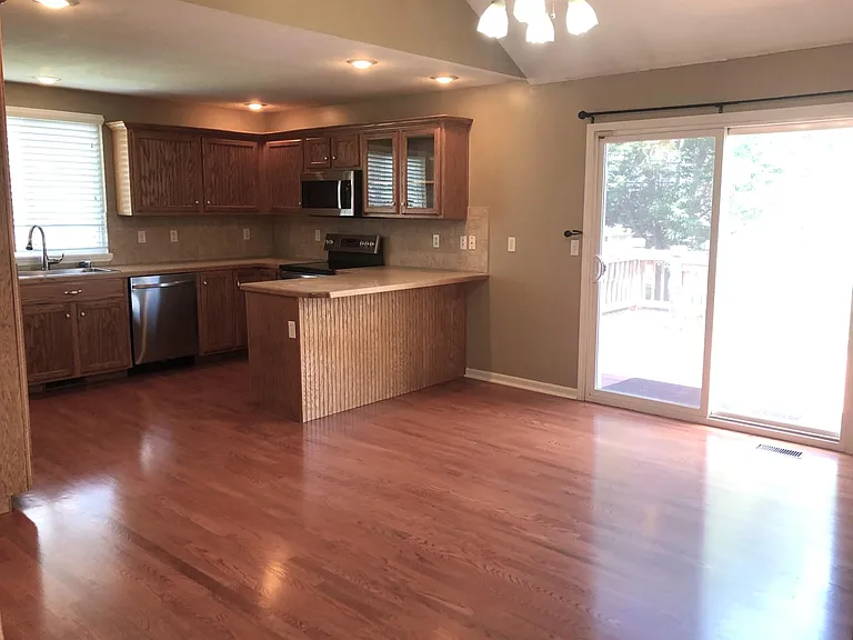 Dining area opens to backyard deck.