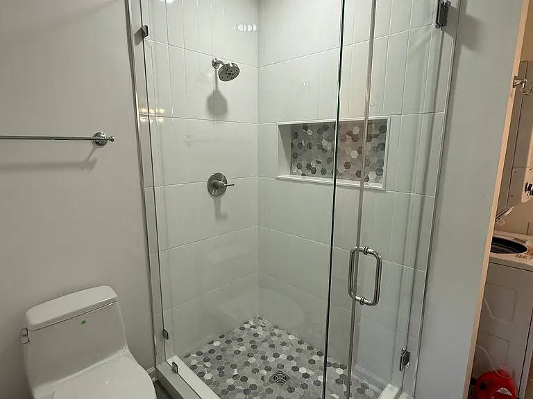 Marble and porcelain bathroom with heated floors, Toto toilet 
Washer dryer