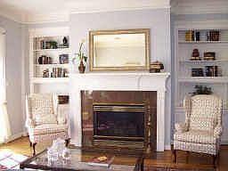 Living room has french doors opening to ample sized back yard. Gaslog fireplace is between the two f