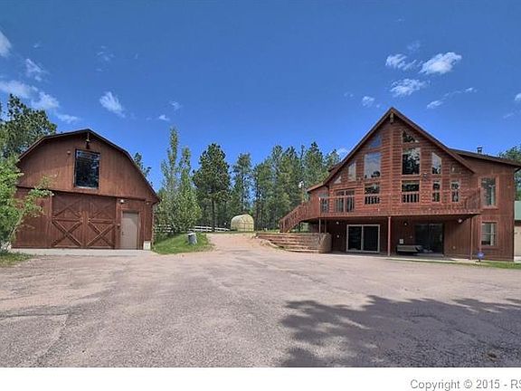 The front of the home has a deck that runs the width of the house. The shop to the left is insulated has both power and water and the upper room is floored for storage. Can be another garage or?