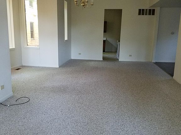 View of dining room, far door leads to kitchen