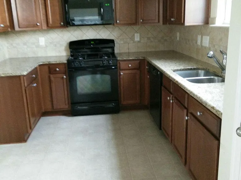 Kitchen with granite counter tops.