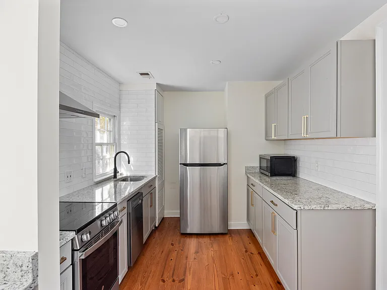 Newly renovated kitchen with Quartz countertops and stainless steel appliances.