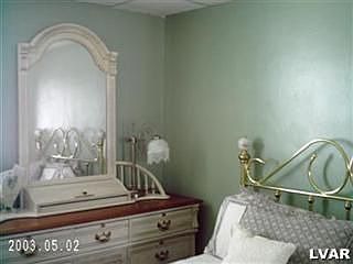 Sunny bedroom with full closet