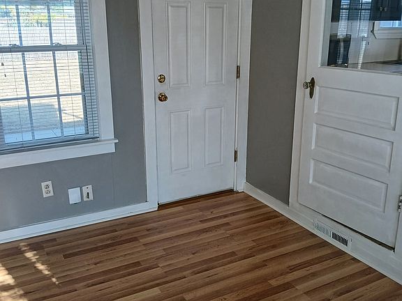 Little room off of the kitchen going to the garage and out back that can be used for a office space