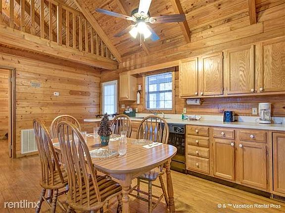 The kitchen includes a breakfast bar