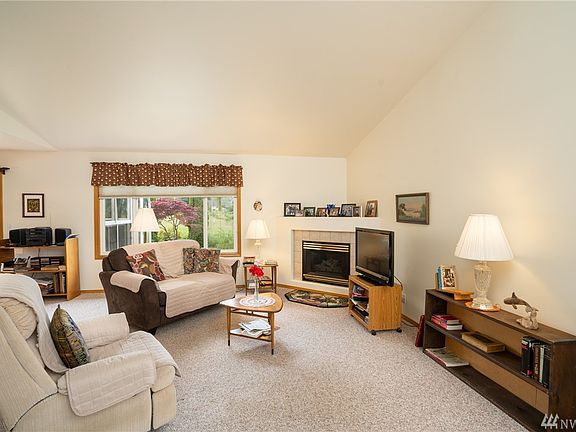Living room with vaulted ceilings and gas fireplace