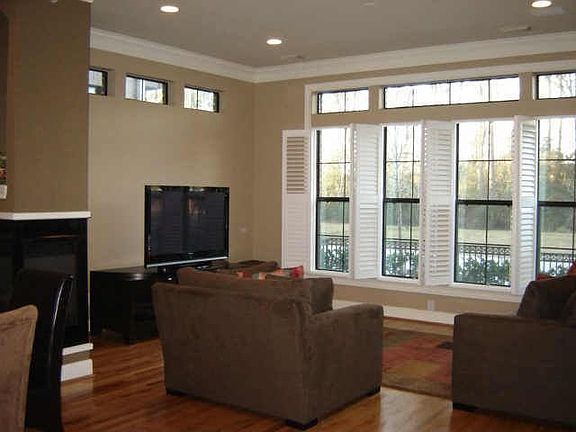 Remote fireplace, plantation shutters,hdwd floors & hdwd. stairs.