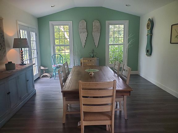 Dining area faces backyard with french doors to patio.