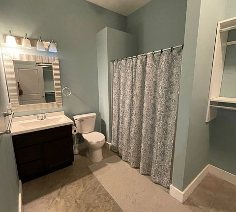 Full bathroom with walk-in shower.