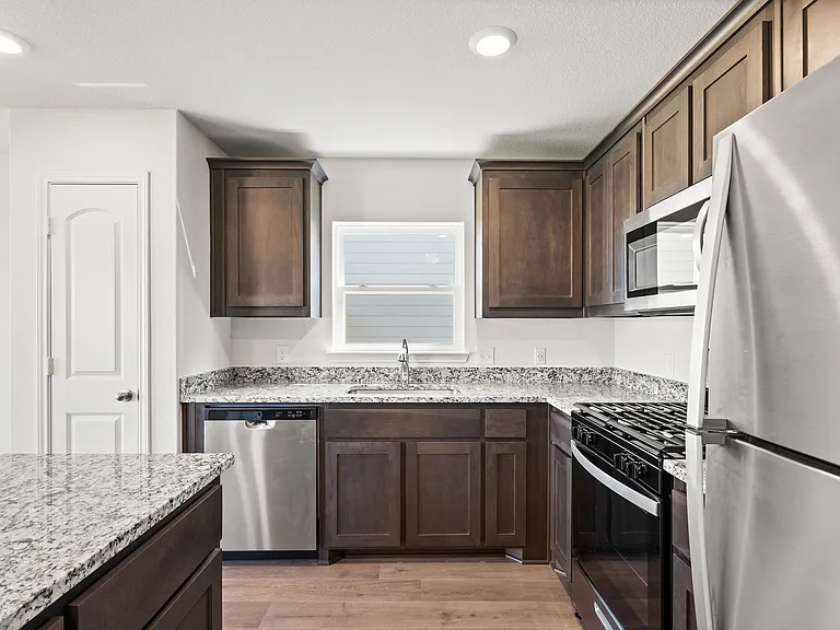 The gorgeous kitchen has energy-efficient, stainless-steel appliances.