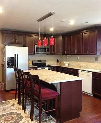 gorgeous renovated kitchen with huge island and granite