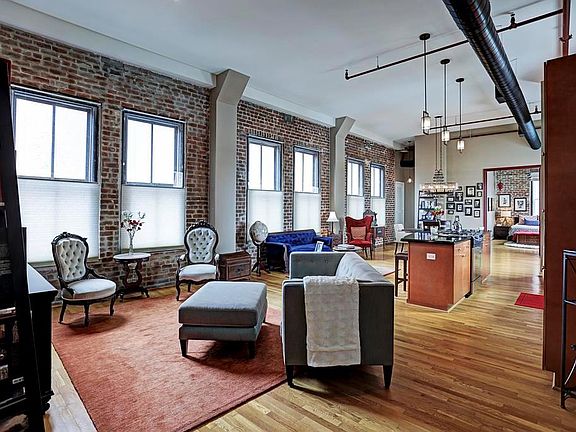 Unit 8J is 1,791 SQ FT of penthouse level, true loft living with open living areas, exposed brick walls & duct work, 12 ceilings & Oak hardwood flooring throughout, no carpet! The unit maintains its original 1900s charm with modern conveniences.