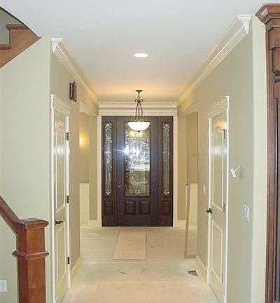 Impressive front door and sidelights, extensive hardwood flooring