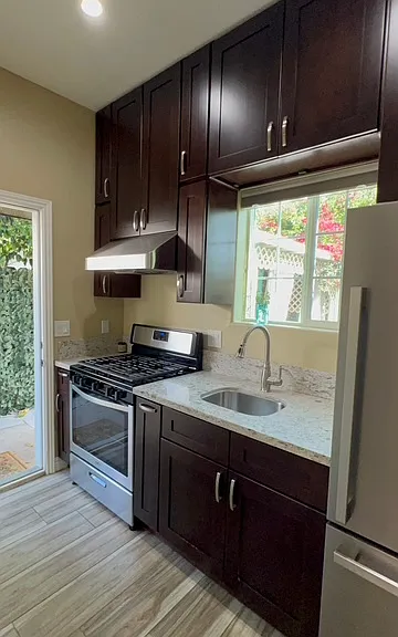 Kitchen and entrance door to unit