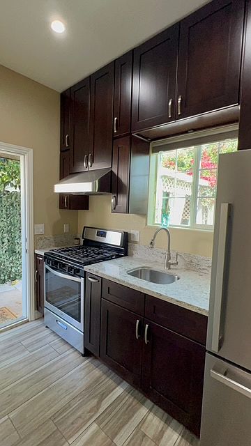Kitchen and entrance door to unit