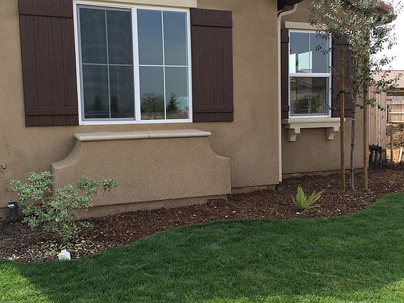 Front of house, bedroom windows