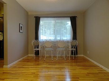 The 10' by 12' dining room overlooks the wonderful back yard, and  has newer exceptionally nice gleaming quality wood floors flowing from room to room! One can't help but notice the nice natural light that this home has throughout, thanks to the oversized, well insulated, Andersen vinyl replacement windows, a name you can trust, found throughout much of the main floor!