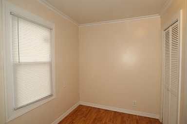breakfast nook features new window and laminate flooring