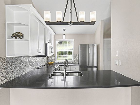 Remodeled kitchen with breakfast bar counter seating