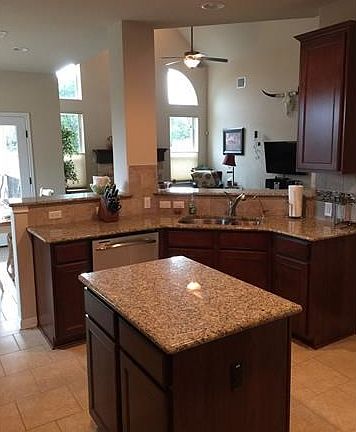 Open floor plan is great for entertaining.  Recessed lights and lots of cabinets in this spacious kitchen.