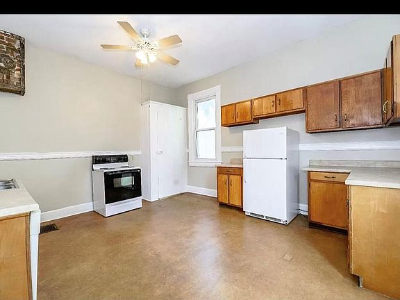 Enter through the large kitchen space.