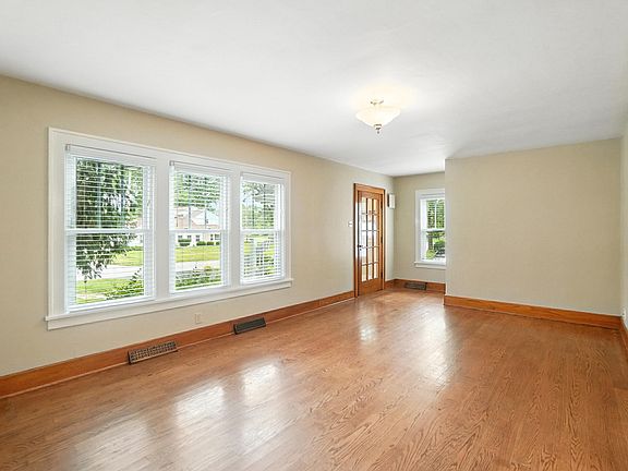 Entrance door leading either to the 2nd and 3rd floor stairs by the window or enter into the living room.