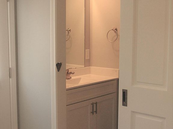 1st floor guest half-bath with barn door sliding door