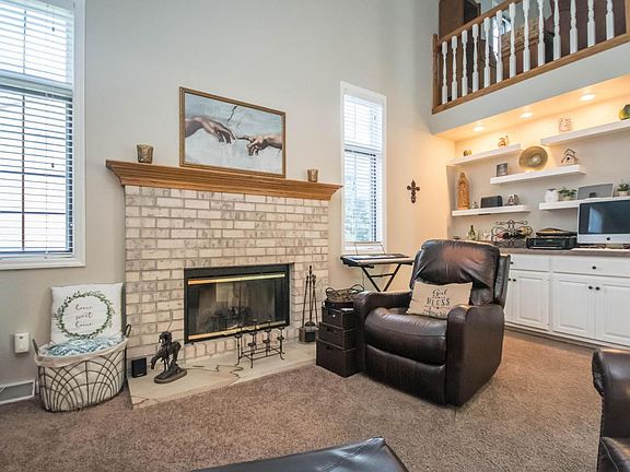 Vaulted living room with fireplace