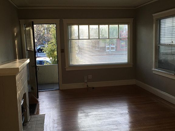 6034 Teleg: Living Rm looking out to Telegraph w/ door open