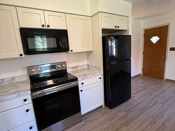 Updated kitchen with new appliances.
