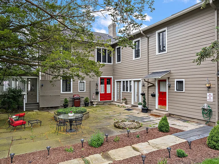 501 A Blackburn Rd , back-of-house double-door entry. Patio.