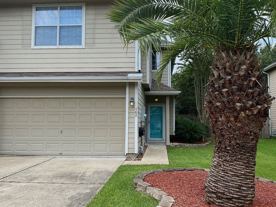 Landscaped front & back yards