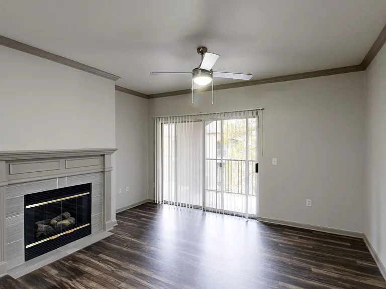 Apartment living room with wood-style flooring.