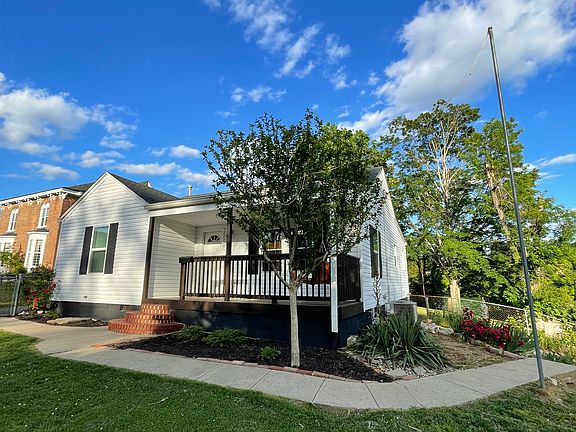 Corner lot with driveways in front and on the side of house.