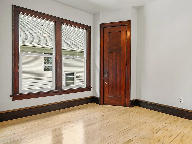 Shot of first bedroom's door to unique original closet.