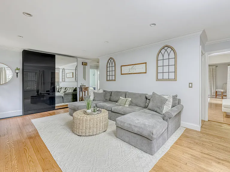 living room with coat closets