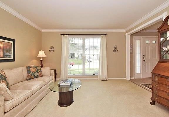 Formal living room with crown molding...can also be an office.