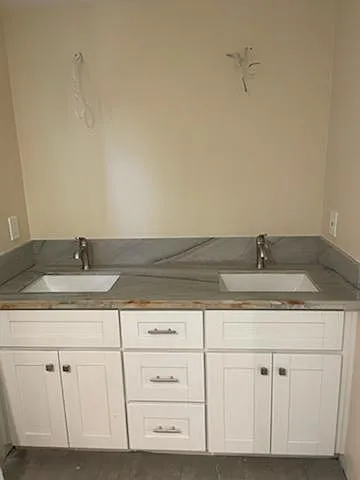 Double Sink with Beautiful Quartz Counter-Top & Brushed Nickel Fixtures throughout