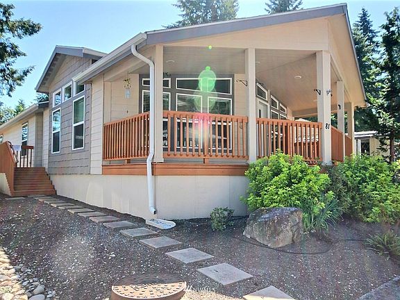 The siding is 50 year cement plank, and the front of this home boasts lots of windows that make the home light and bright.
