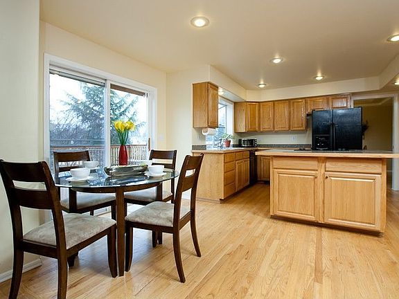 Large kitchen has eat-in space plus a computer area