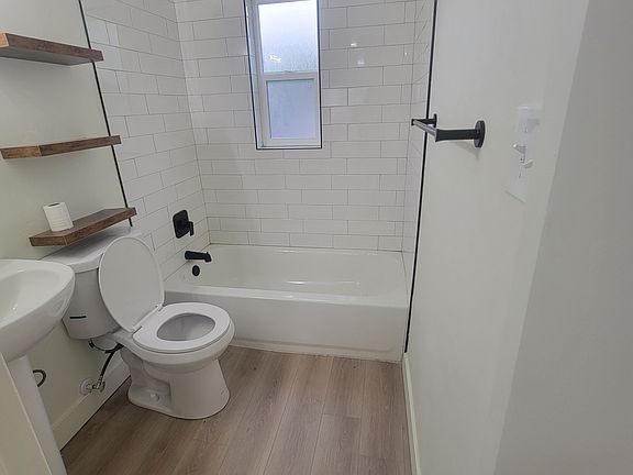 Gorgeous bathroom with a brand new tub shower combo