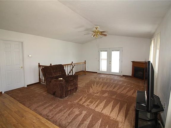 Beautiful Great Room w/ Cathedral Ceilings and French Doors (w/ adjustable blinds inside glass panes) lead onto 24x8 Deck to 40x