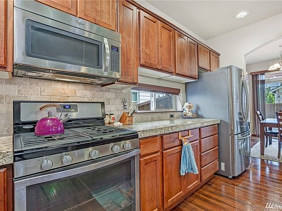 Stainless appliances including 5-burner gas range
